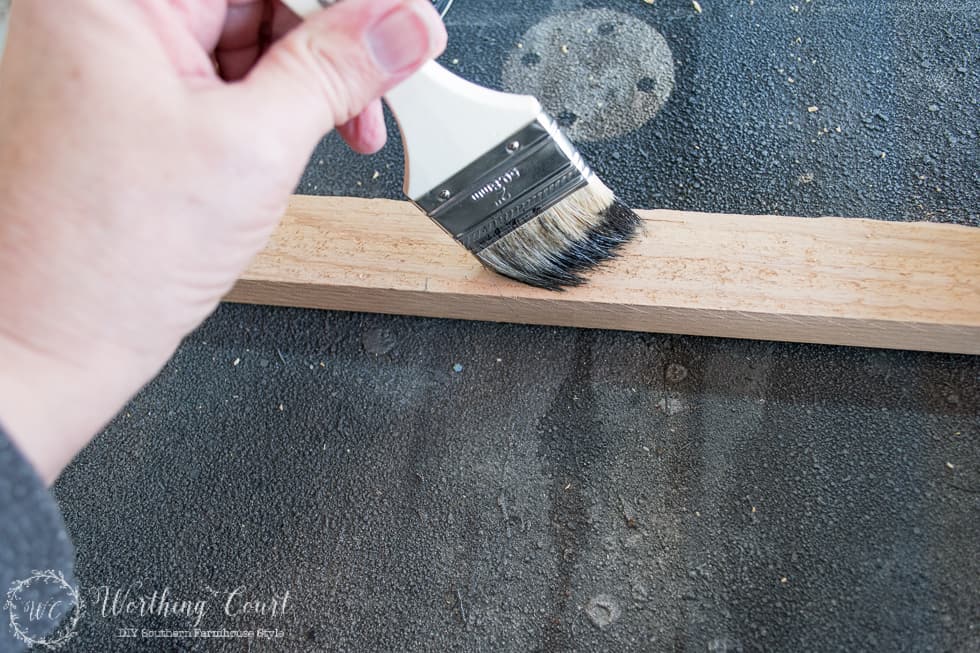 Painting the wooden ladder.