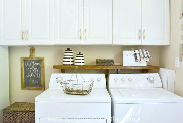 A kitchen with a sink and a microwave