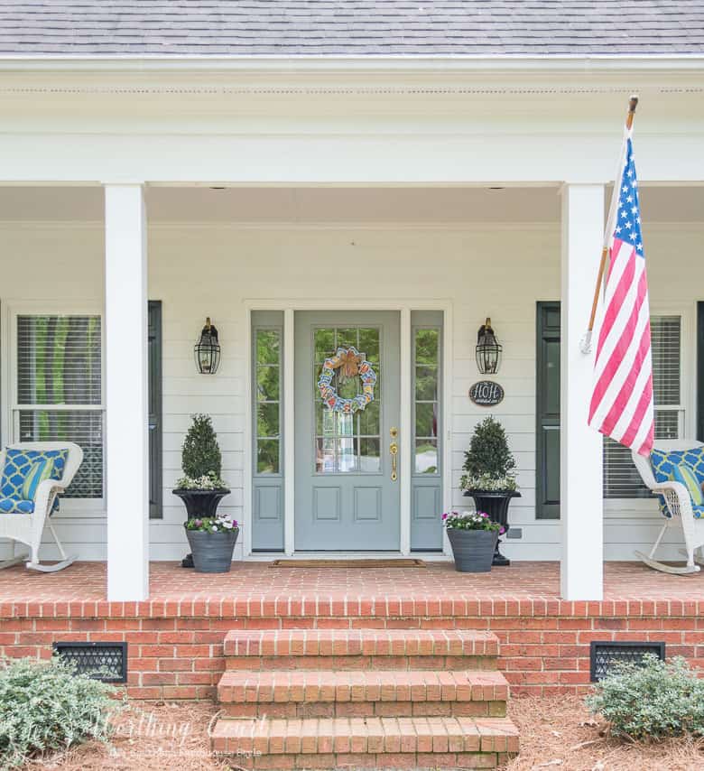 A front porch with farmhouse style and simple to do planters