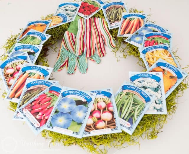 garden theme wreath with seed packets attached