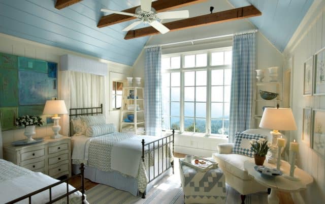 A beautiful and inviting bedroom decorated in blue and white.