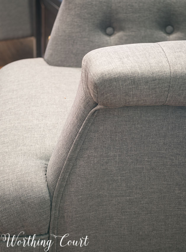 Gray tufted arm chair from Hayneedle- welting detail