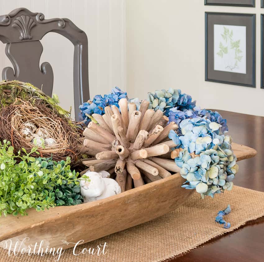 Summer dough bowl arrangement with dried hydrangeas.