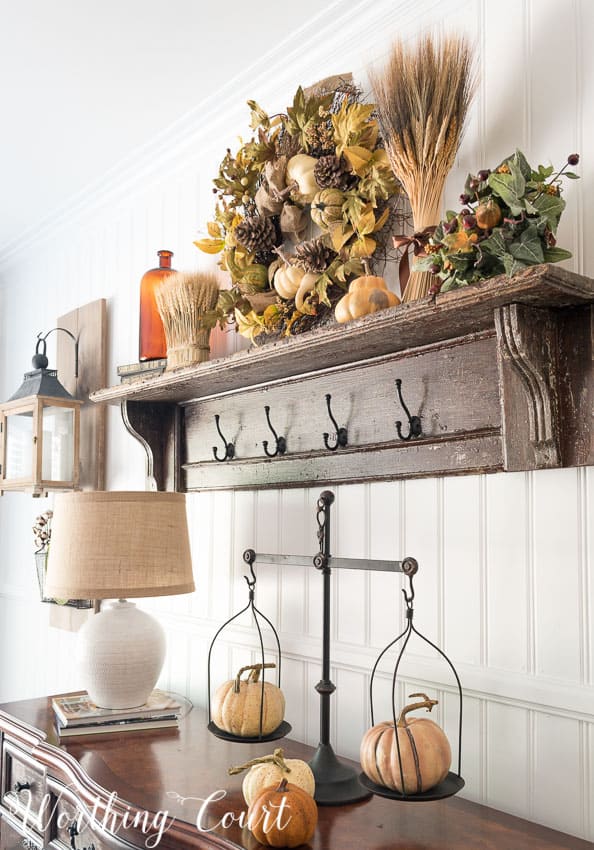 The top of a vintage mantel becomes a shelf when the legs are cut off