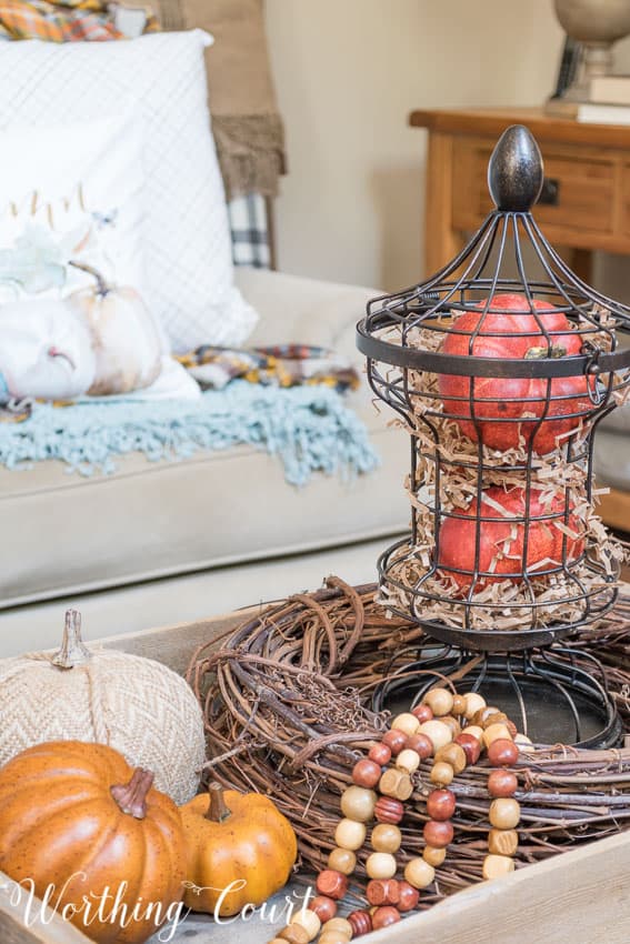 Add strands of craft beads for fall texture to a vignette || Worthing Court