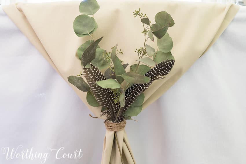 Try gathering a table runner on the ends, tying it with twine and tucking in a few natural elements for your Thanksgiving table || Worthing Court