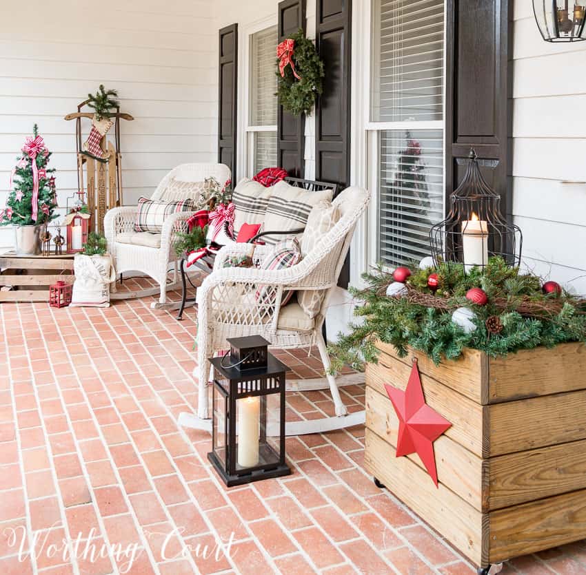 Front porch with farmhouse Christmas decorations.