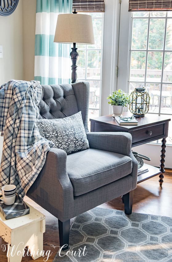 Gray wing chair with tufted back || Worthing Court