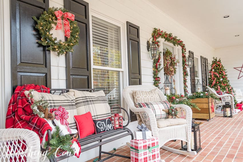 There are throw blankets in a plaid pattern on the chairs.