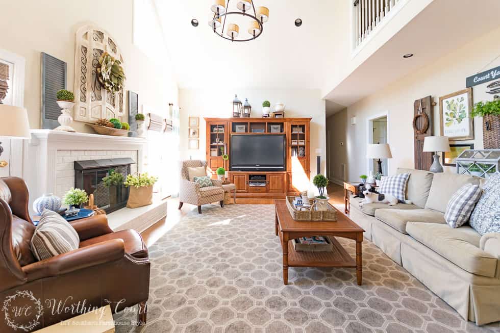 A very dated and traditional family room transformed to suburban farmhouse style.