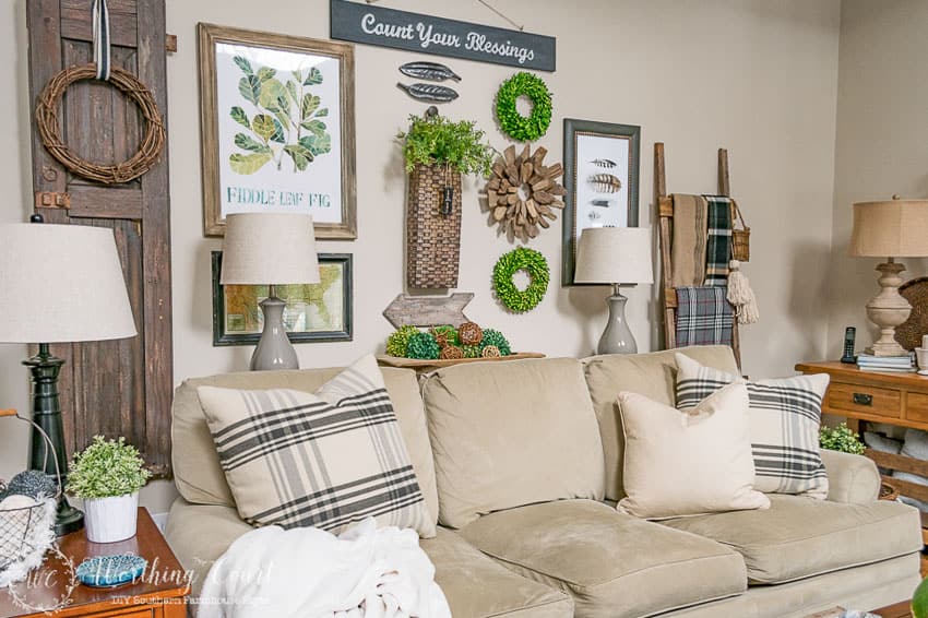 gallery wall above sofa using vintage finds