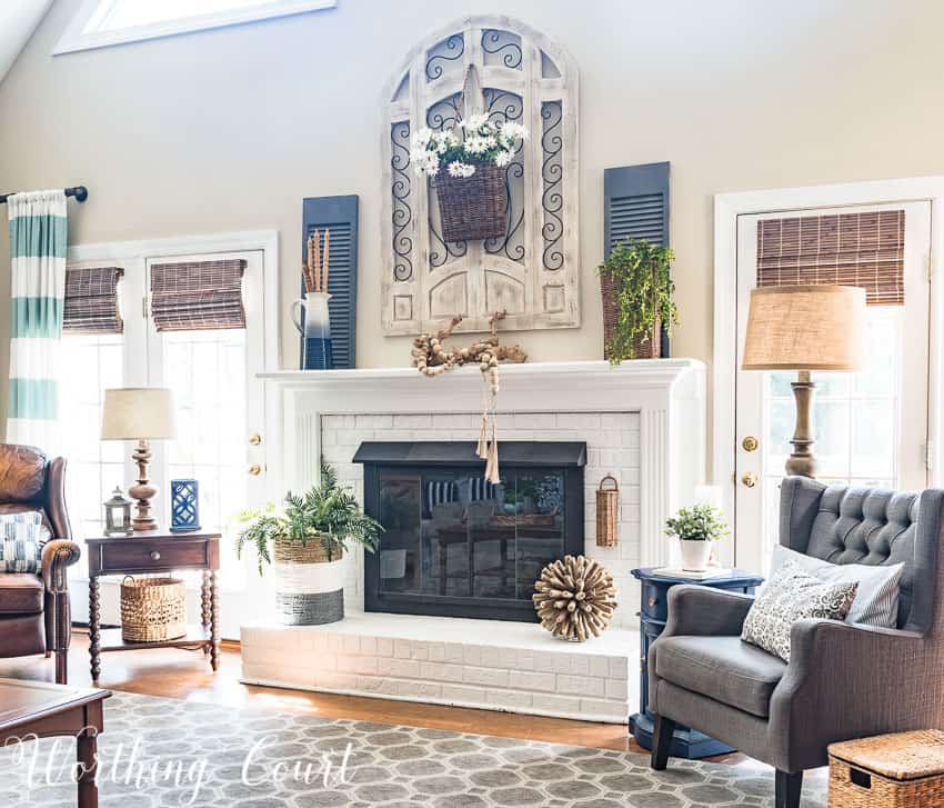 Painted brick fireplace decorated with natural and organic elements for summer || Worthing Court