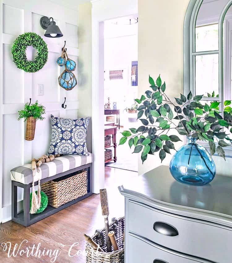 Farmhouse style board and batten foyer wall decorated for summer with turquoise and green || Worthing Court