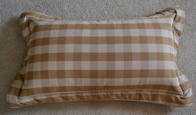 blue and cream colored checked pillow sham