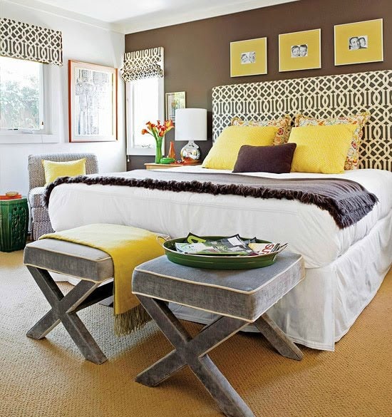Pops of yellow in this brown and white bedroom.