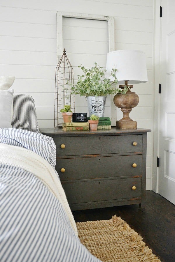 Great tips for how to add style to a small bedroom. Use furniture pieces to do double duty. A small chest both serves as a nightstand and holds clothing.