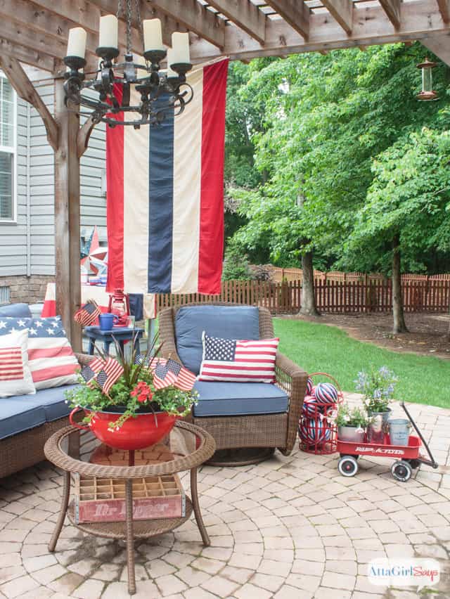 outdoor seating area with red white and blue decor