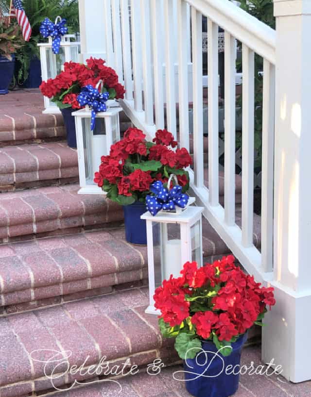 red brick steps with white lanterns and blue and red flowers