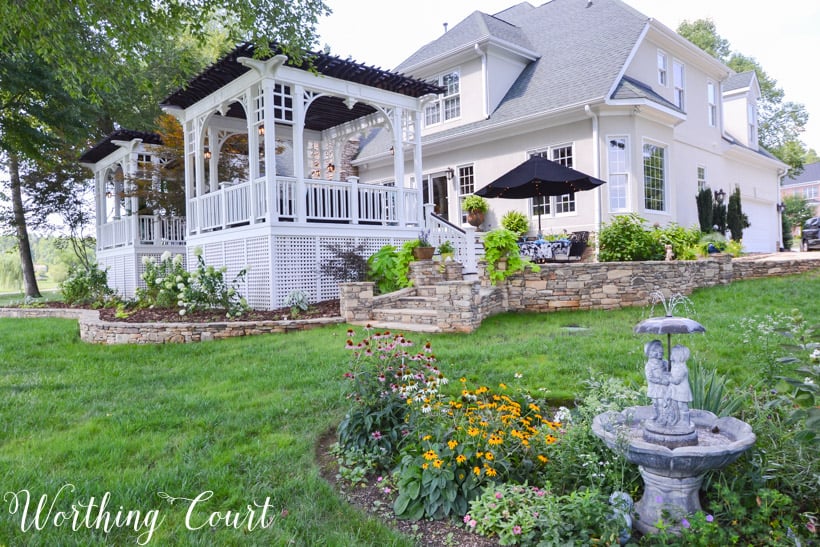 Deck with two pergolas and lattice skirting.