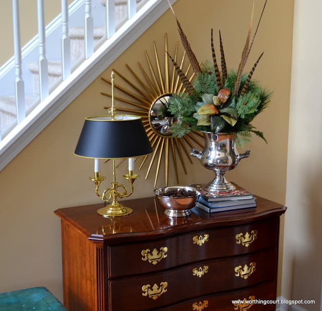 Christmas arrangement with greenery and feathers in a champagne bucket via Worthing Court blog Christmas arrangement with greenery and feathers in a champagne bucket via Worthing Court blog