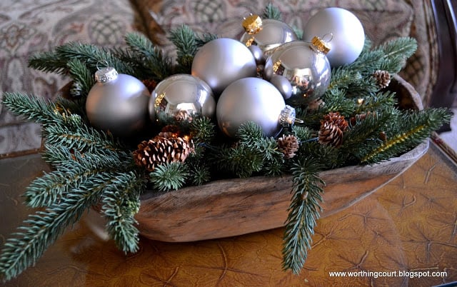 Christmas arrangement in a dough bowl using greenery and silver ornaments via Worthing Court blog Christmas arrangement in a dough bowl using greenery and silver ornaments via Worthing Court blog