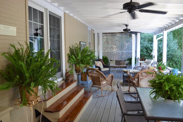 A Covered Back Porch Filled With Vintage Goodies