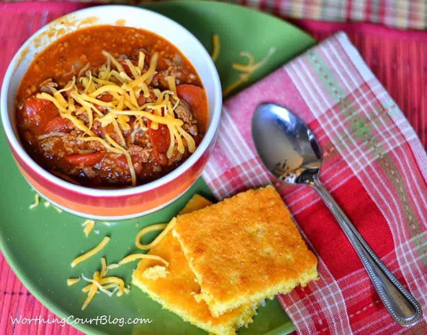30 Minute Chili Recipe with the child in a bowl on the table with cornbread beside it.