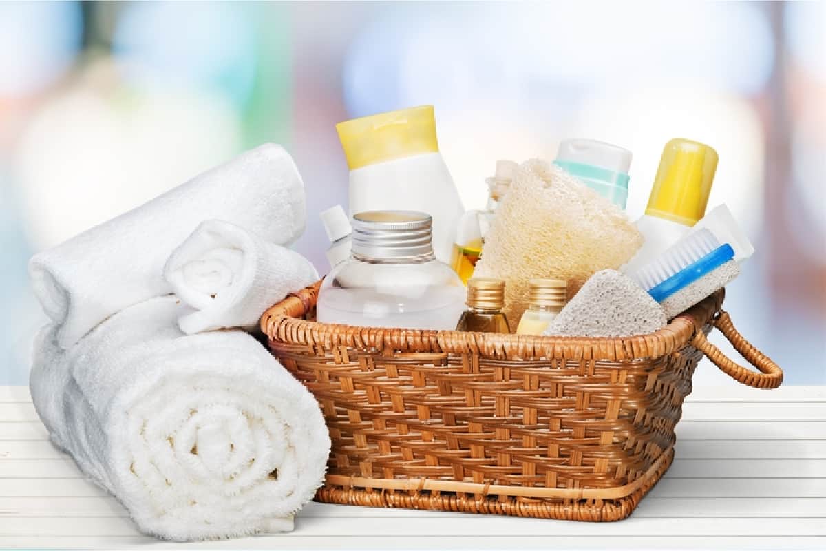 wicker basket filled with various toiletries to welcome guests