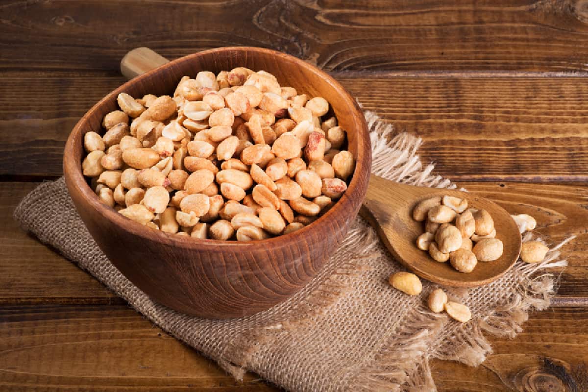 wood bowl filled with peanuts