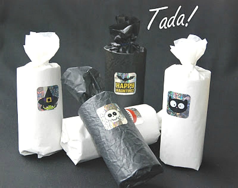 Halloween treat bags made with tp holders and tissue paper in black, white and silver.