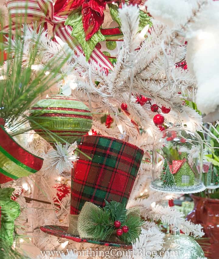 White Christmas tree with red and green ornaments, and plaid.