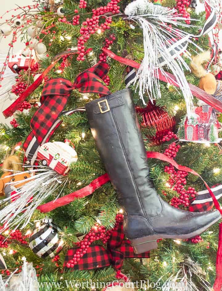 Riding boot wired to a Christmas tree.