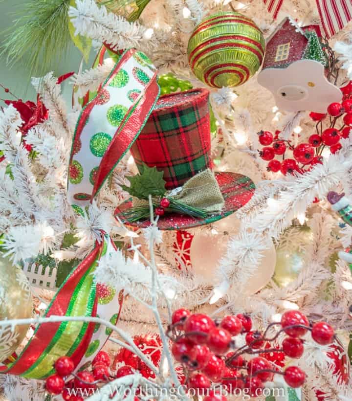 White Christmas tree with red and green decorations.