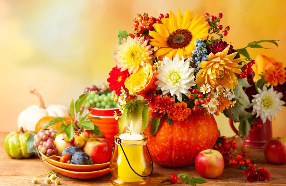 floral arrangement in a pumpkin for a Thanksgiving centerpiece
