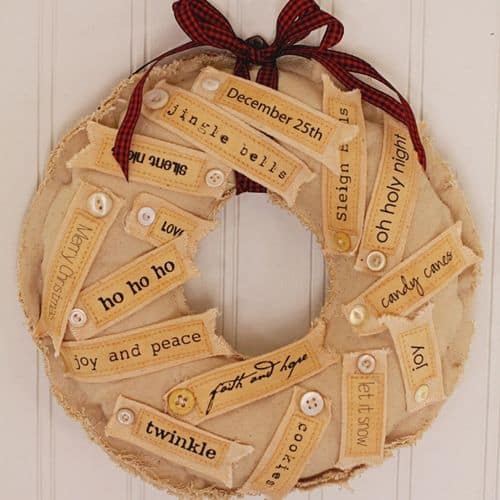 Stamped ribbon with the words ho ho and oh holy nigh glued onto a wreath.
