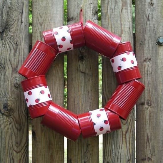 Tin cans painted red and formed into a Christmas wreath.