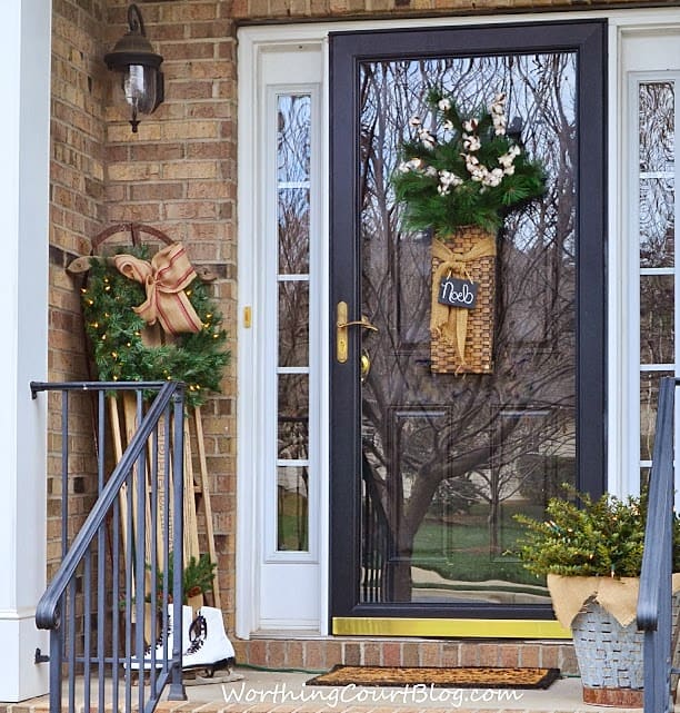  Christmas front porch decorations with a wreath on the door.