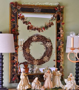 Nativity scene and Christmas decorations on the sideboard.