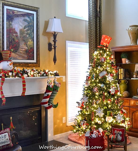 A fireplace mantel decorated for the holidays.