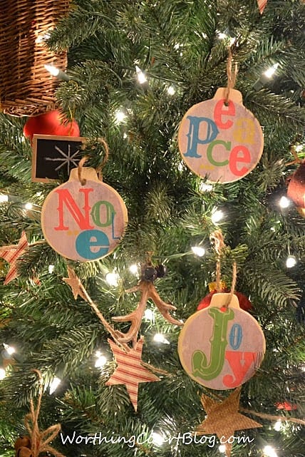 Ornaments that say Peace, Noel, and Joy.