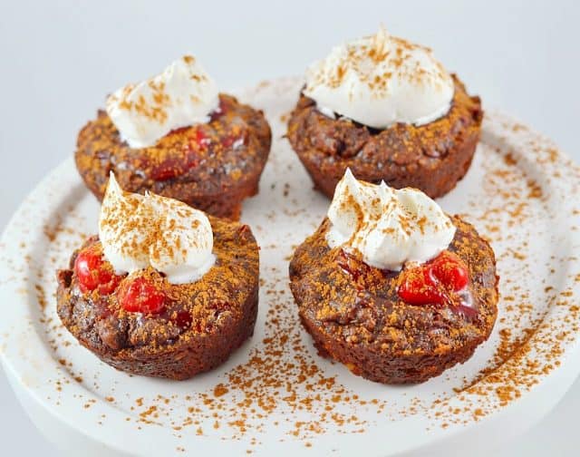 Four brownie bites on a plate.