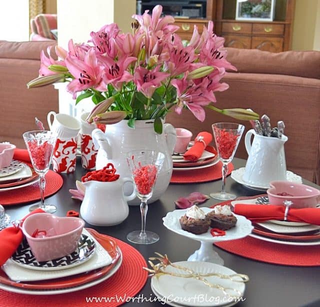 A bouquet of pink flowers is on the table.