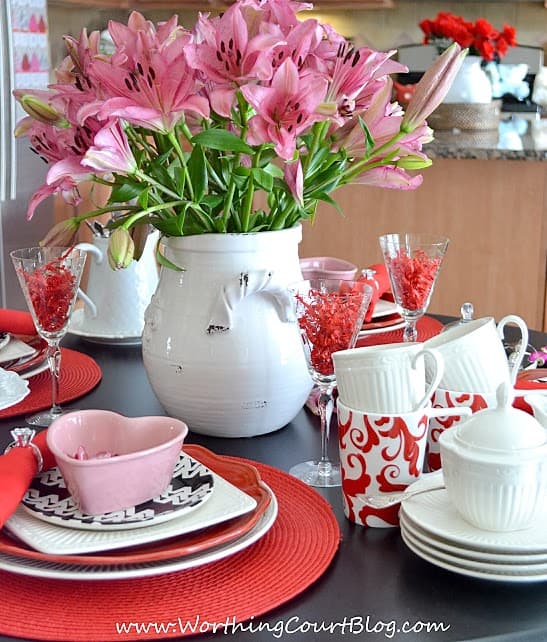 A heart shaped dish is on the table.