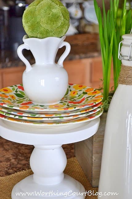 Easy and cheery 5 minute Spring vignette on a kitchen island with daffodils and other natural elements. 