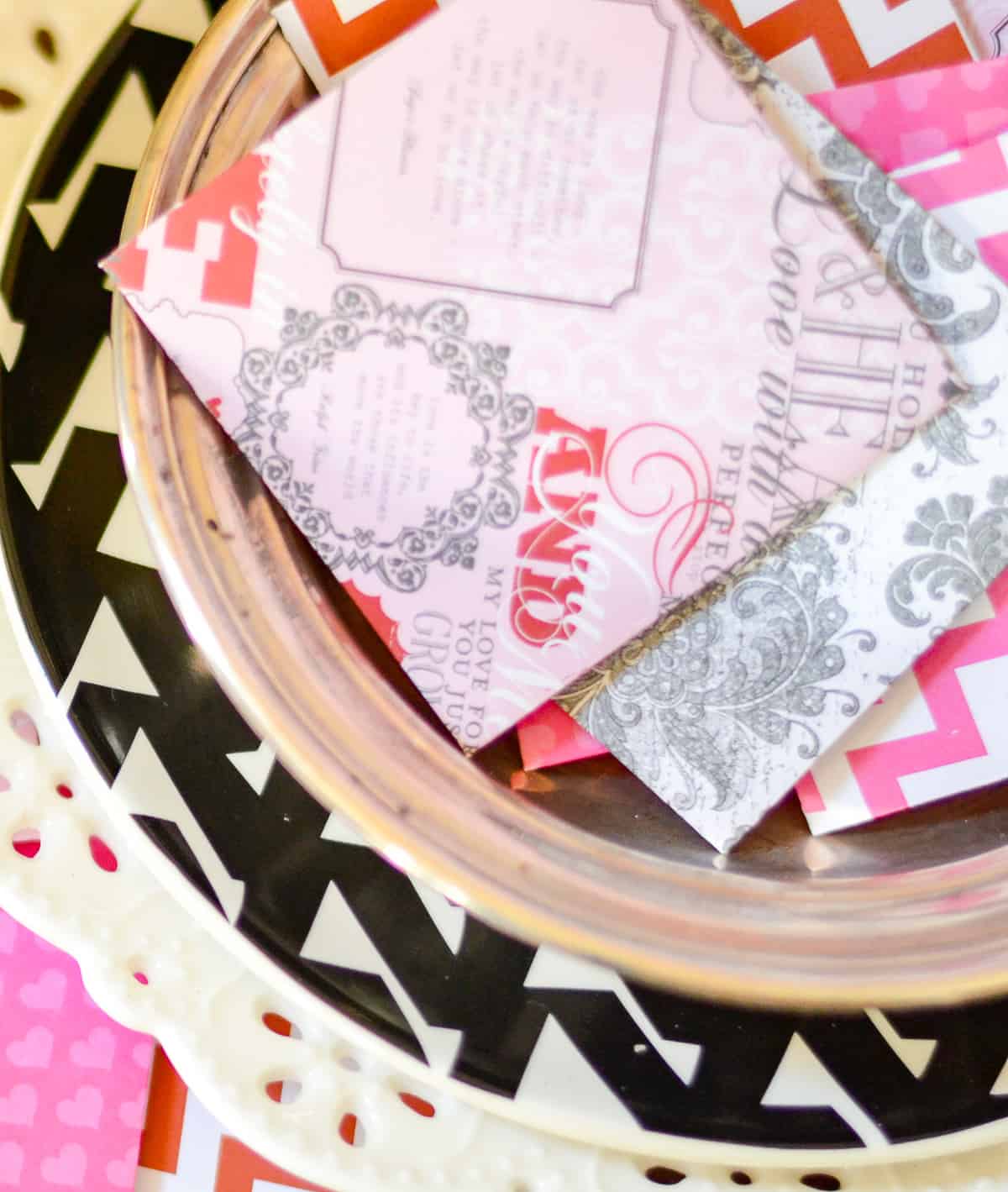 An assortment of mini Valentine's Day cards made with scrapbook paper