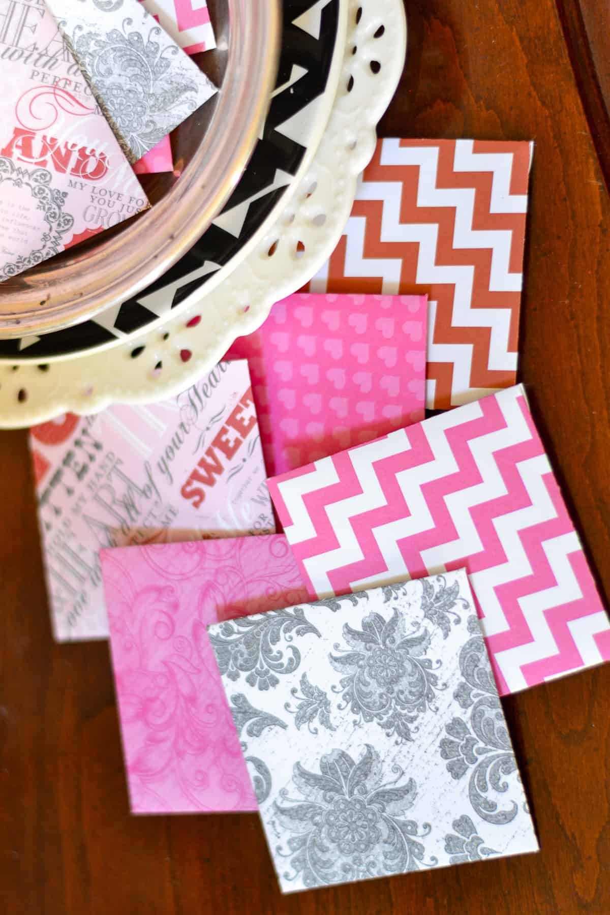 An assortment of mini Valentine's Day cards made with scrapbook paper