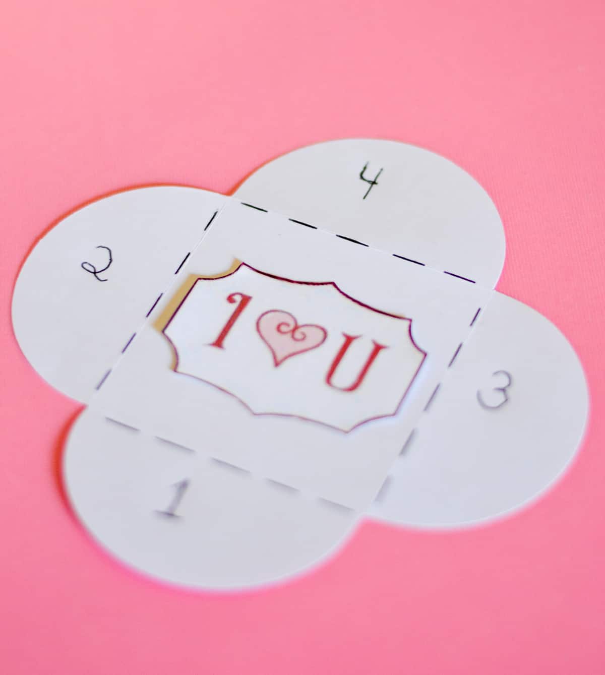 Picture of one of the steps for diy mini Valentine's Day cards made with scrapbook paper.