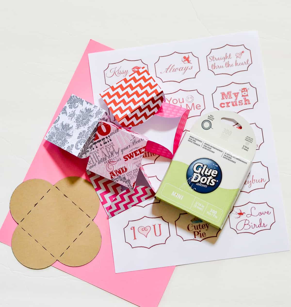 Supplies need to make mini Valentine's Day cards made with scrapbook paper