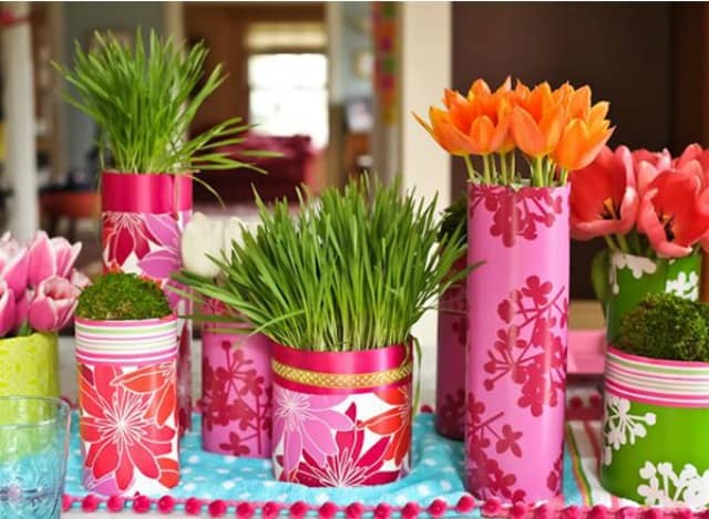 Wrap tin cans or containers from the dollar store with colorful wrapping paper and fill with spring flowers. Group them together for high impact!