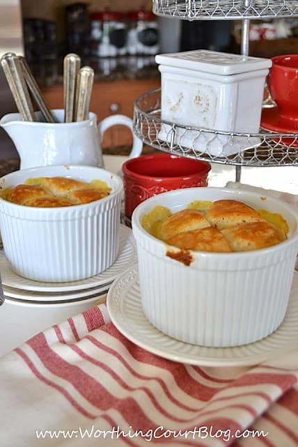 This easy to prepare chicken pot pie is comfort food at it's finest with two pot pies in white baking dishes on the table.